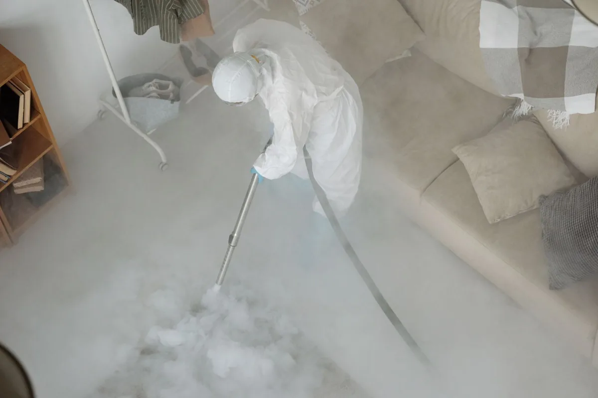 Biohazard cleanup technician in protective equipment, Sherburn, MN